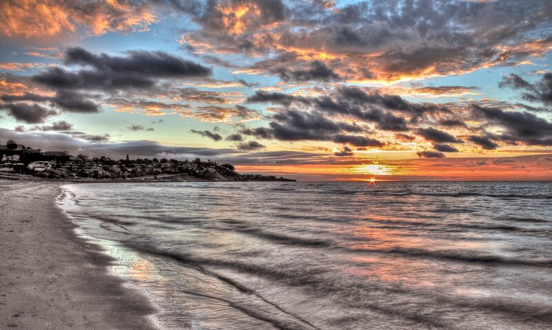 Sunset over Ocean Beach — Orange, Dramatic, Photograph, Clouds, Houses, Blue