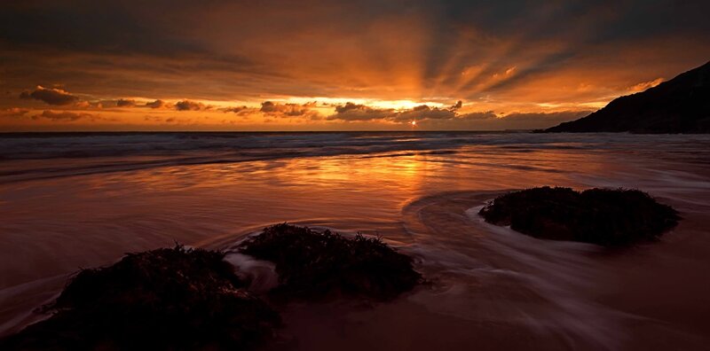 Sunset over Ocean Beach — Orange, Dramatic, Photograph, Clouds, Waves, Rocks