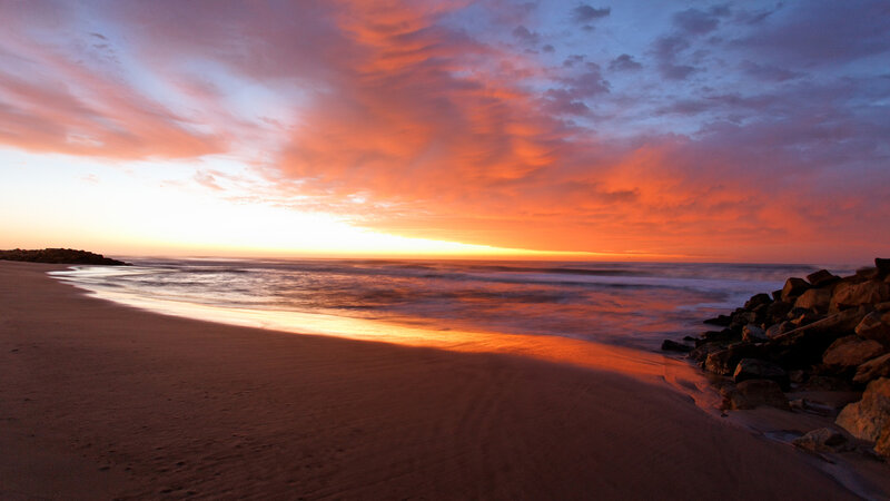Sunset over Ocean Beach — Orange, Dramatic, Photograph, Sand, Rocks