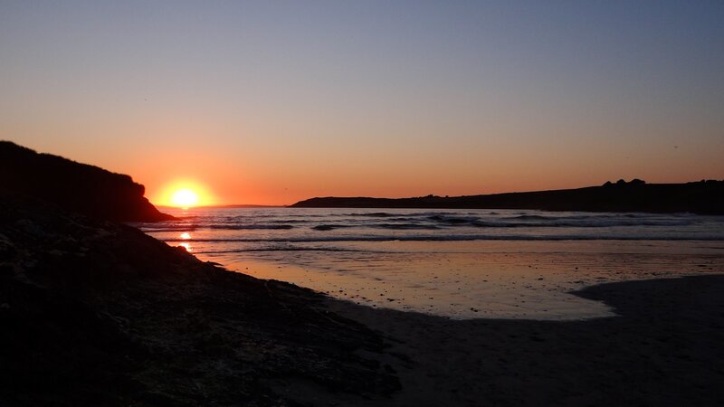 Sunset over Ocean Beach — Orange, Serene, Photograph, Cliff