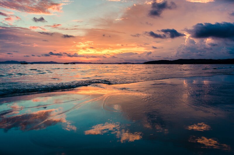 Sunset over Ocean Beach — Orange, Serene, Photograph, Clouds, Boats