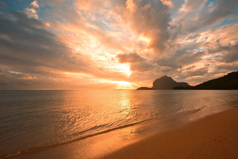 Sunset over Ocean Beach — Orange, Serene, Photograph, Clouds, Mountain, Sand