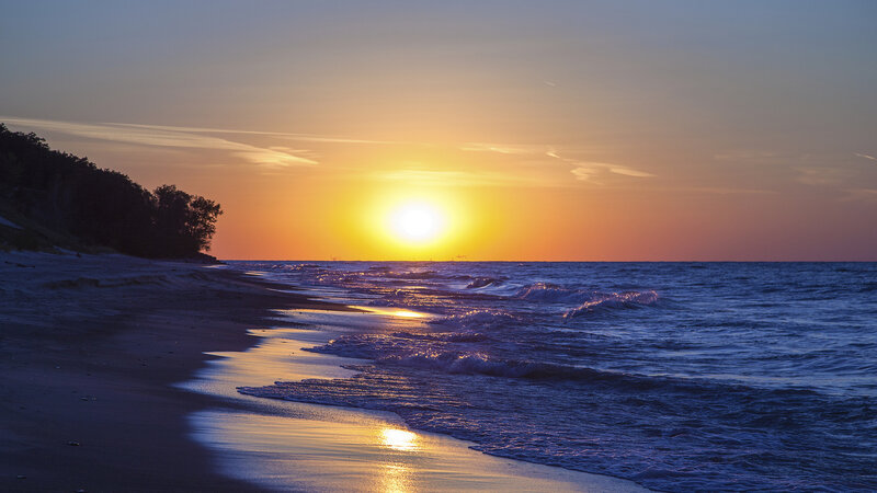 Sunset over Ocean Beach — Orange, Serene, Photograph, Sand, Trees