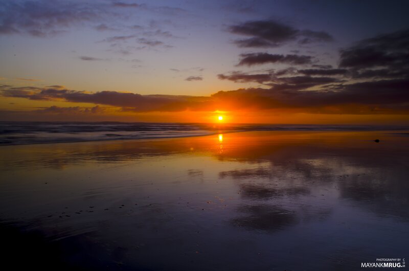 Sunset over Ocean Beach — Orange, Serene, Photograph, Sun, Clouds, Sand