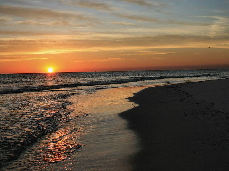 Sunset over Ocean Beach — Orange, Serene, Photograph, Sun, Sand, Clouds