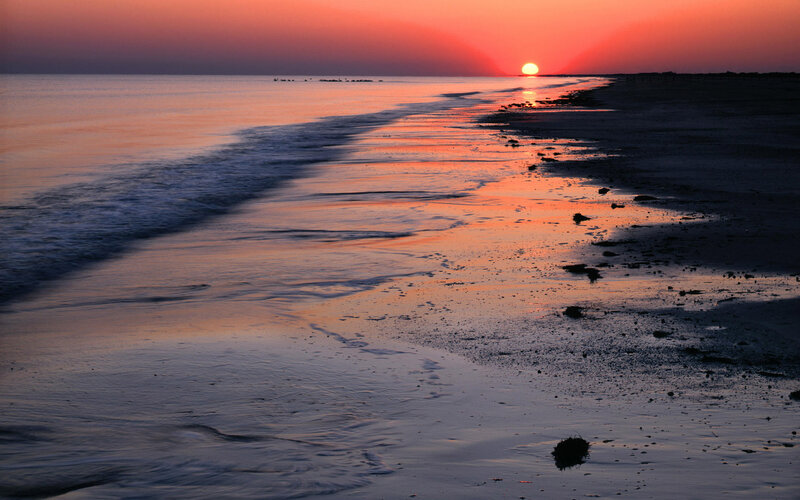 Sunset over Ocean Beach — Orange, Serene, Photograph, Sun, Sand, Purple