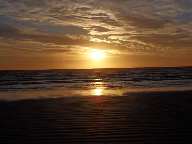 Sunset over Ocean Beach — Orange, Serene, Photograph, Sun, Sand, Yellow, Brown