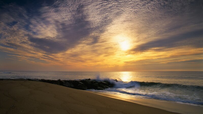 Sunset over ocean beach