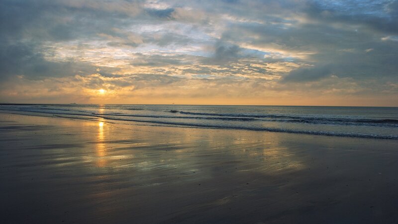 Sunset over Ocean Beach — Yellow, Serene, Photograph, Sun, Clouds