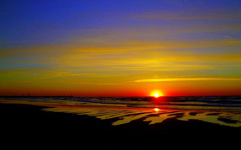 Sunset over Ocean Beach — Yellow, Serene, Photograph, Sun