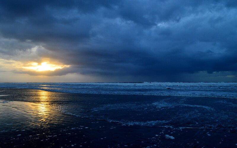 Sunset over Ocean — Blue, Dramatic, Photograph, Clouds, Beach, Waves, Yellow