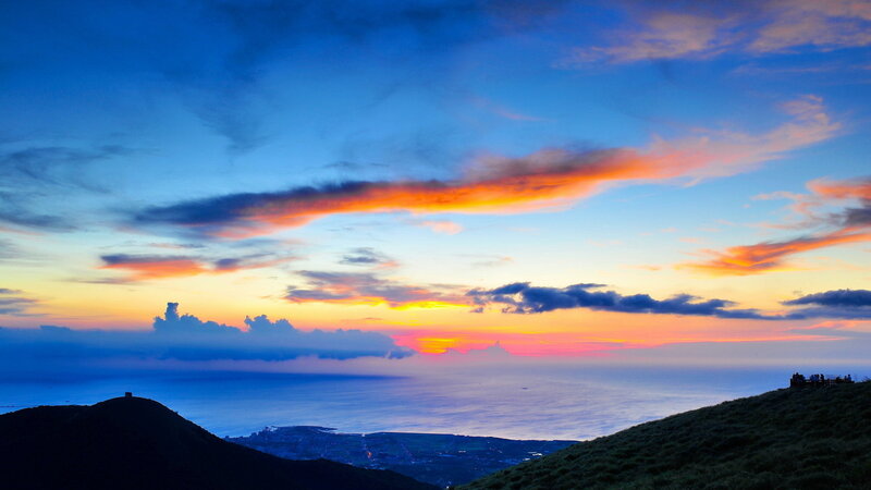 Sunset over Ocean — Blue, Dramatic, Photograph, Clouds, Hills
