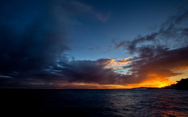 Sunset over Ocean — Blue, Dramatic, Photograph, Clouds, Land
