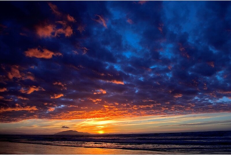 Sunset over Ocean — Blue, Dramatic, Photograph, Clouds, Mountain