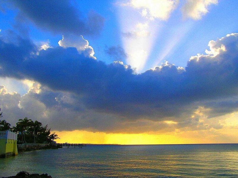 Sunset over Ocean — Blue, Dramatic, Photograph, Clouds, Palm Trees