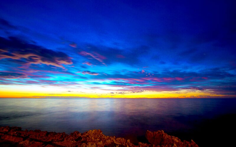 Sunset over Ocean — Blue, Dramatic, Photograph, Clouds, Rocks, Horizon