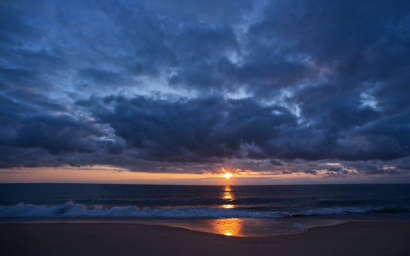 Sunset over Ocean — Blue, Dramatic, Photograph, Clouds, Sand, Waves