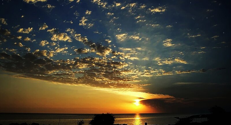 Sunset over Ocean — Blue, Dramatic, Photograph, Clouds, Sea, Silhouette