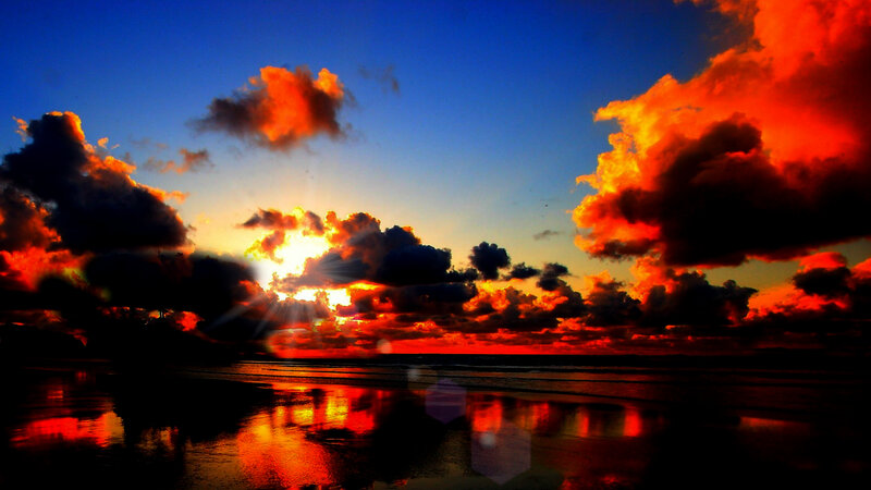 Sunset over Ocean — Blue, Dramatic, Photograph, Clouds, Sun, Beach