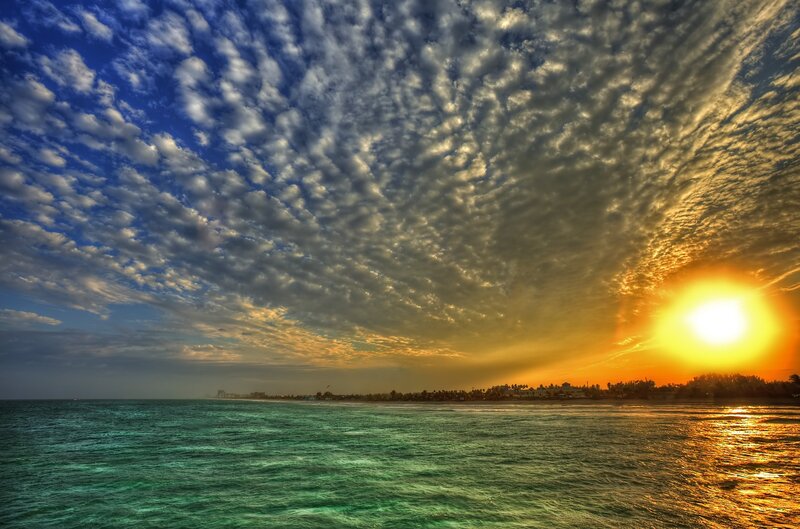 Sunset over Ocean — Blue, Dramatic, Photograph, Clouds, Sun, Coastline