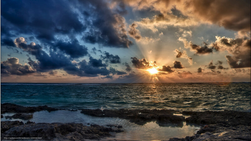 Sunset over Ocean — Blue, Dramatic, Photograph, Clouds, Sun, Rocks, Sea