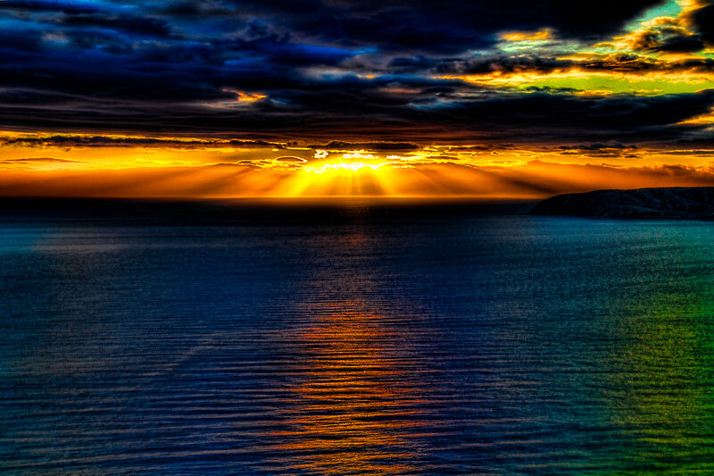 Sunset over Ocean — Blue, Dramatic, Photograph, Clouds, Sunlight, Cliff