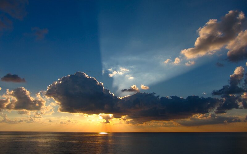 Sunset over Ocean — Blue, Dramatic, Photograph, Clouds, Sunlight