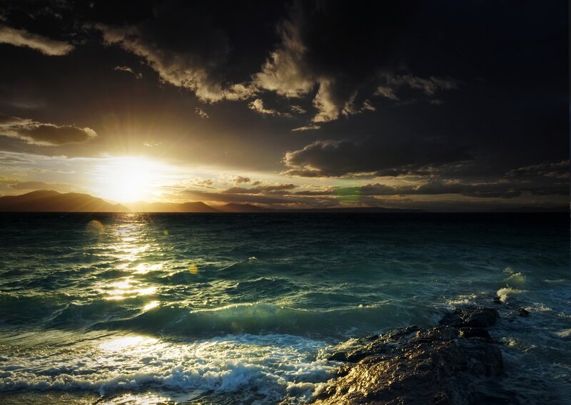 Sunset over Ocean — Blue, Dramatic, Photograph, Mountains, Clouds