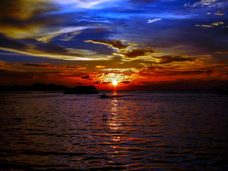 Sunset over Ocean — Blue, Dramatic, Photograph, Sun, Boat