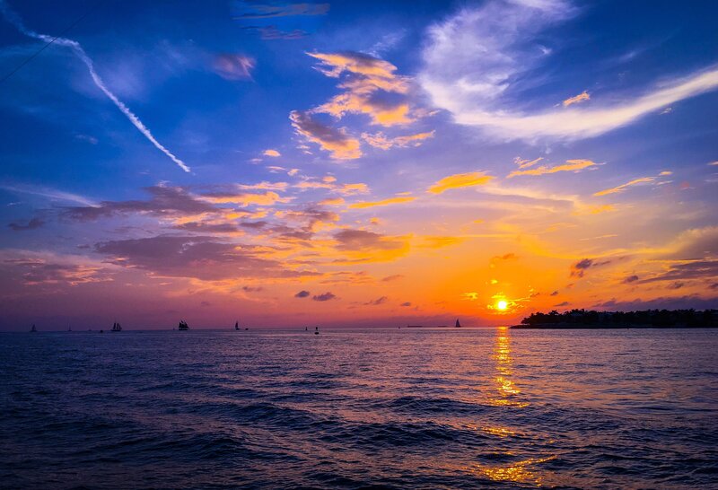 Sunset over Ocean — Blue, Serene, Photograph, Clouds, Boats