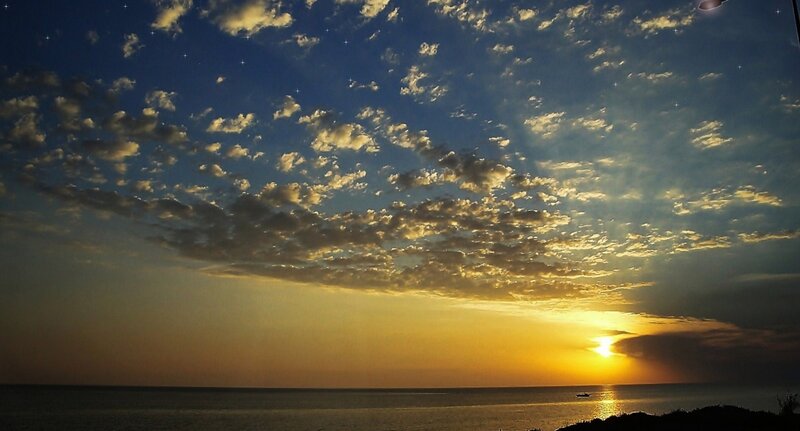 Sunset over Ocean — Blue, Serene, Photograph, Clouds, Sun, Boat