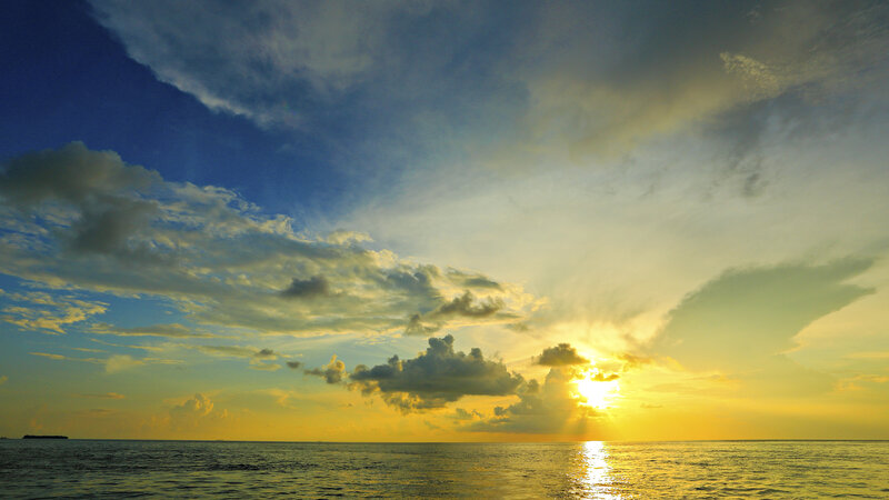 Sunset over Ocean — Blue, Serene, Photograph, Clouds, Sun, Sea