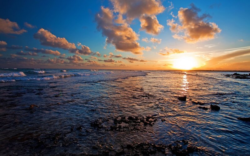 Sunset over Ocean — Blue, Serene, Photograph, Clouds, Waves, Rocks