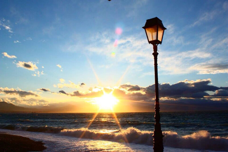 Sunset over Ocean — Blue, Serene, Photograph, Lamppost