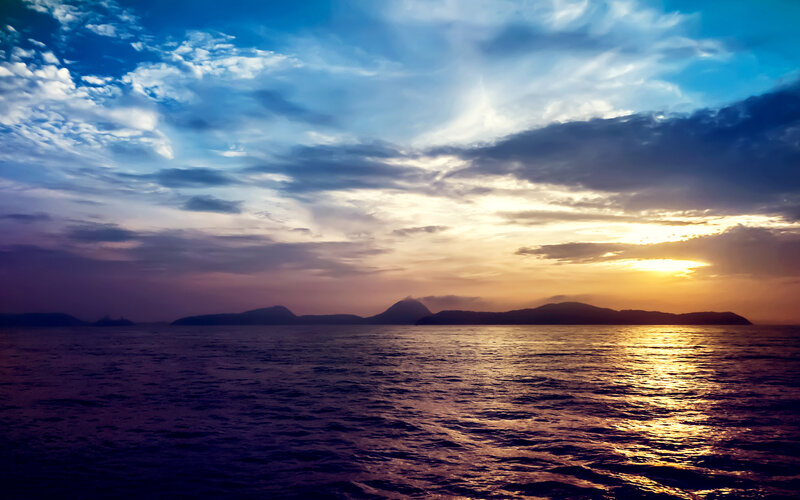 Sunset over Ocean — Blue, Serene, Photograph, Mountains