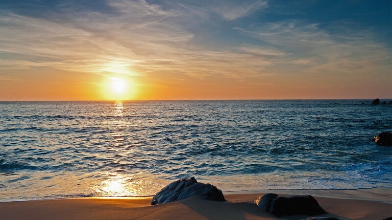 Sunset over Ocean — Blue, Serene, Photograph, Sand, Rocks