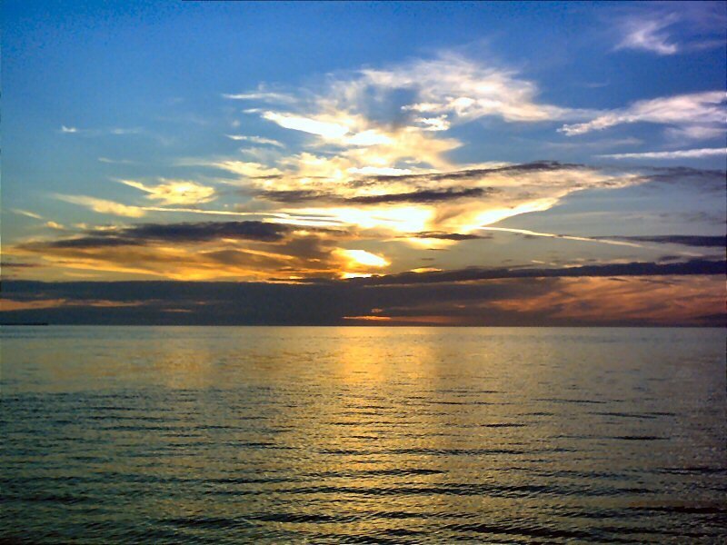 Sunset over Ocean — Blue, Serene, Photograph, Sky, Clouds, Water, Yellow