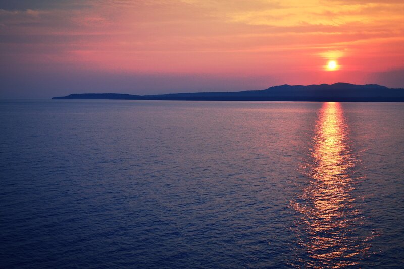 Sunset over Ocean — Blue, Serene, Photograph, Sun, Island