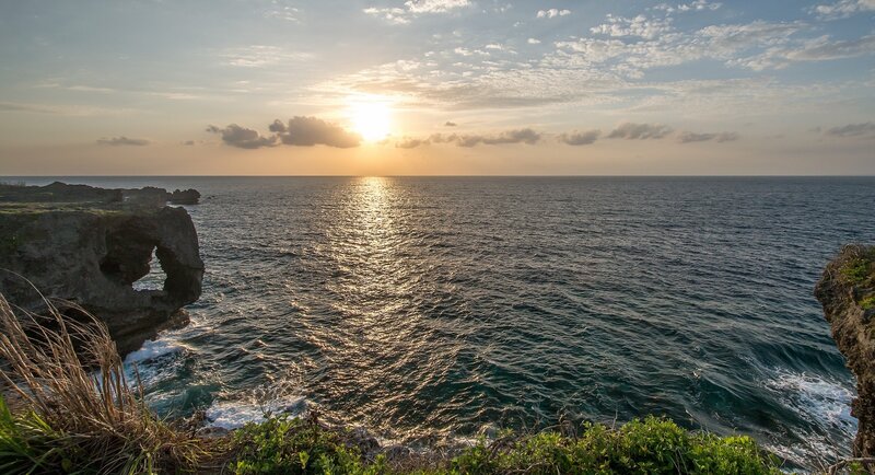 Sunset over ocean cliffs
