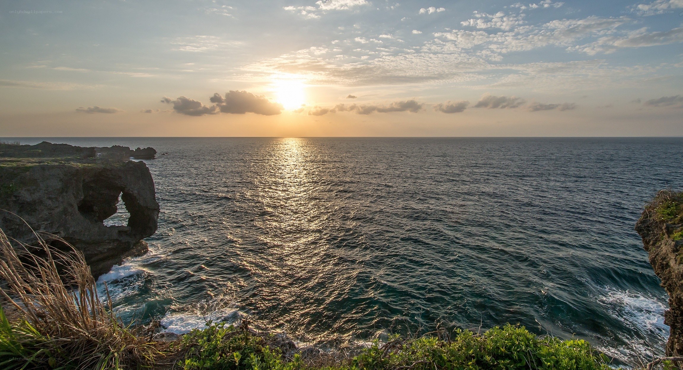 Sunset over ocean cliffs