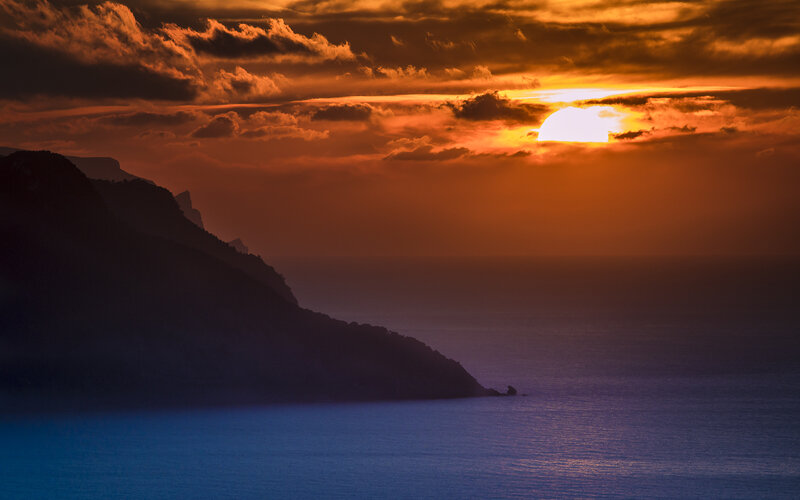 Sunset over Ocean Cliffs — Orange, Dramatic, Photograph