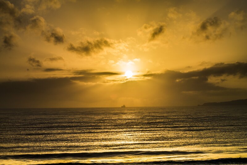 Sunset over Ocean — Gold, Dramatic, Photograph, Sun, Clouds, Ship