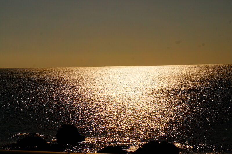 Sunset over Ocean — Gold, Serene, Photograph, Rocks