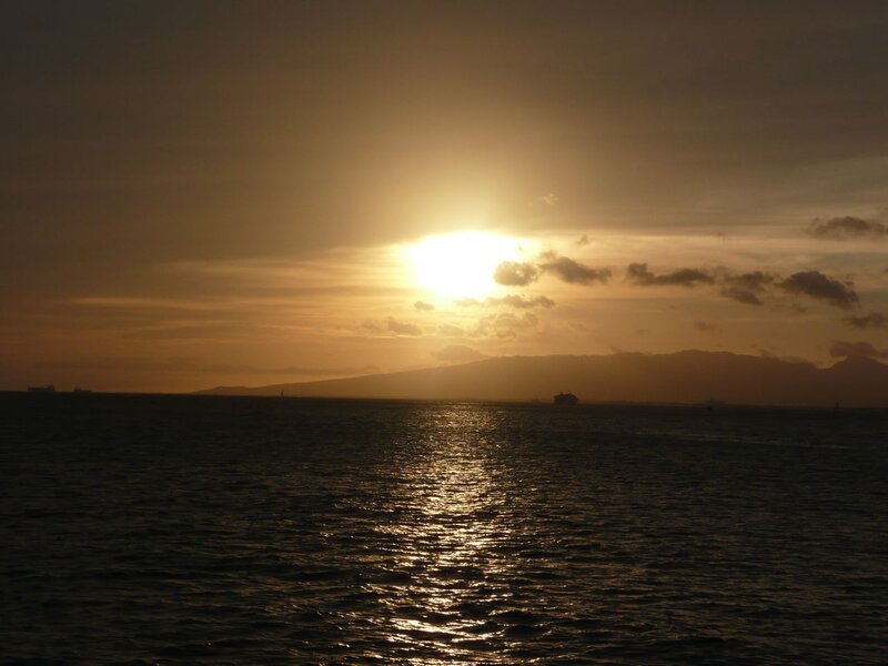 Sunset over Ocean — Gold, Serene, Photograph, Sun, Clouds, Mountains