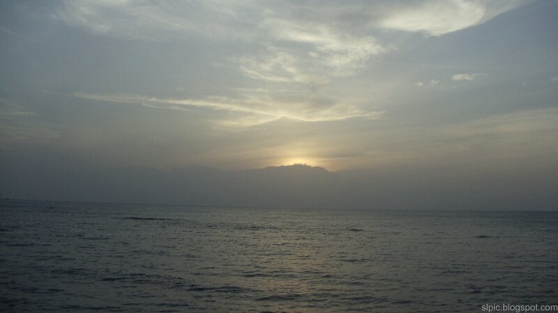 Sunset over Ocean — Gray, Calm, Photograph