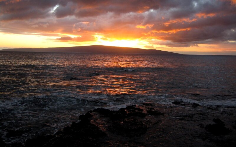 sunset over ocean island