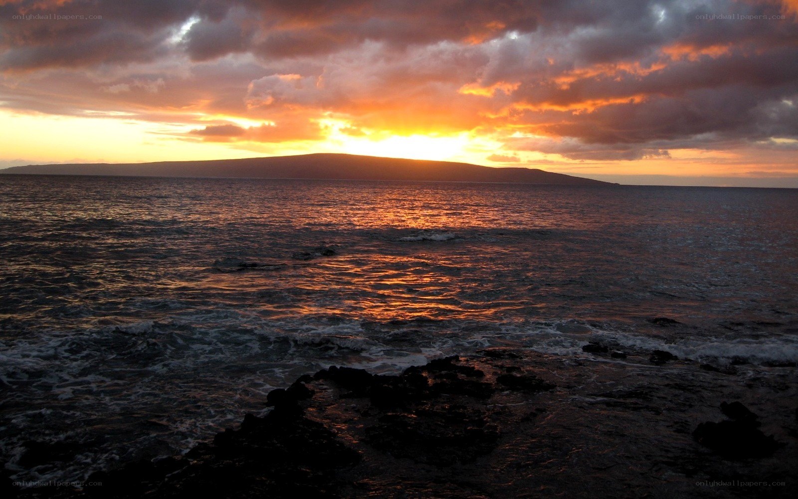 sunset over ocean island