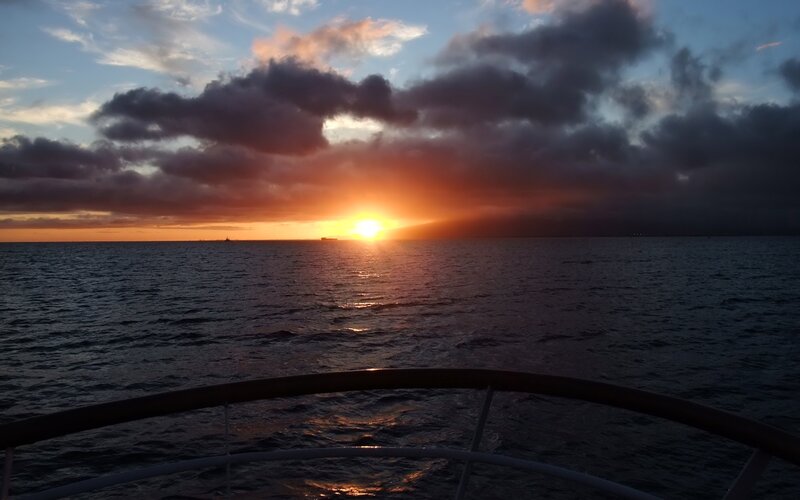 Sunset over Ocean — Orange, Dramatic, Photograph, Boat Railing