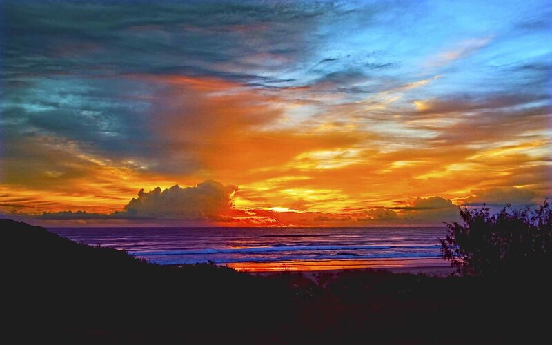 Sunset over Ocean — Orange, Dramatic, Photograph, Clouds, Beach, Silhouette, Blue, Black