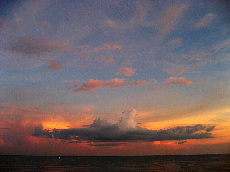 Sunset over Ocean — Orange, Dramatic, Photograph, Clouds, Boat, Blue